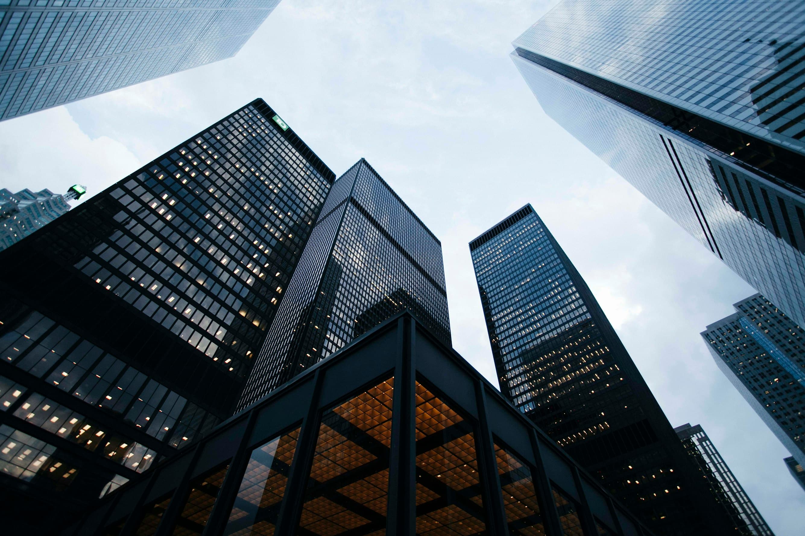 Modern commercial architectural glass office building with solar window film